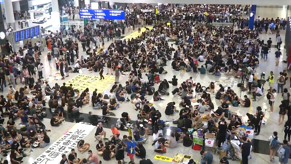 Hundreds Of Hong Kong Pro-Democracy Protesters Occupy Airport