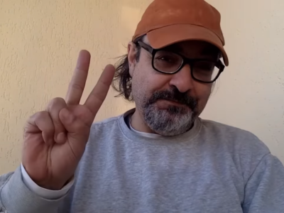A screengrab shows late journalist Gonzalo Lira holding up a peace sign in a video he uploaded on his YouTube channel on October 17, 2022.
